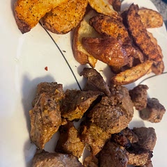 Marinated steak and seasoned potato wedges. Made ours in the air fryer. Potatoes on 400 for 15 minutes. Flipped them. 15 more minutes. Added steak bites in for 10 more minutes.