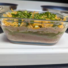 This was really delicious. Perfect for a party. To make it a bit healthier unused refried beans instead of bean dip and Greek yogurt instead of sour cream. I also halved it. 