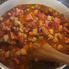 I loosely followed this recipe. The first time, like in the picture, I added 2 chicken thighs. The second time, I added shrimp, too. If you add shrimp, pre season and then add it after the dish is done. I then cover the pot again and let the shrimp sit and cook in the broth for 5-8 minutes depending on the size of the shrimp. Soooo good.