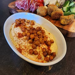 Delicious hummus! Added roasted chickpeas tossed in paprika. Go too for boards and sharing plates