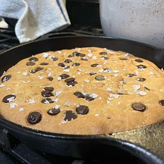Baked in a non-stick cast iron like a pizookie. Despite forgetting salt, tasted GREAT and gooey. Sprinkled big ol’ salt flakes on the top to make up for it.