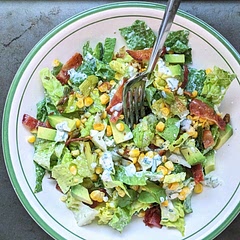Removed most of the seeds from the jalapeno and the dressing still had a nice kick. Added bacon.