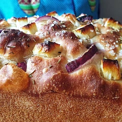 Finally got around to making it. Huge success and absolutely delicious. Used feta, red onion, and dried rosemary as topping. My pan was slightly smaller, but that made the loaf a bit thicker which was actually nice.