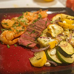 In addition to the Shrimp I added steak to it as well. For the paprika I used smoked paprika instead,  served with roasted zucchini and pattypan squash. 