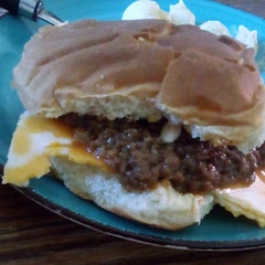 I added a tsp. Pepper, a tsp. Kosher salt, and a tsp onion powder.  Toasted the buns and served with a slice is asigo white cheddar cheese.  Yum...enough for my break at work tomorrow and the families lunch 