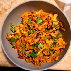 Came out really good. I added diced jalepeños and black beans. This big pan didn't last long. Cilantro and sour cream on top make the flavors pop even more. 