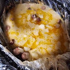 I added 2 cups of water to ensure that all the potatoes had a medium to cook in, then added a dollop of sour cream and a sprinkle of cheddar when I dipped out a bowl. Tasted great.