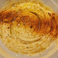 This was a really good hummus recipe to use as a base. I added more garlic, less lemon juice and some other seasonings. It's smooth and creamy. The recipe is definitely a keeper. 
