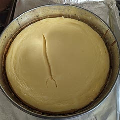This was my first time baking cheesecake and It Was Fire. 
I was a bit underwhelmed initially but it was delicious after being in the fridge overnight.

The recipe says bake 75 minutes but in her video she says between 65-75. 65 minutes worked great and I'm glad I checked the vid first! 
 
Not sure what exactly caused the unsightly crack — perhaps the springform pan that's probably older than I am or the fact that we didn't spread the crust up on the sides. But it adds character. 