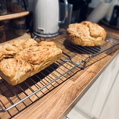 Doesn’t look anything like the one in the recipe does 😂 it’s my first time ever making bread so taking the positives from it 

I tripled the ingredients due to the amount of yeast I had to use so ended up with a lot of dough which I split into 3 separate containers. 

Have only tried the larger round bread so far, it’s a bit dense to be truthful that being said it is very tasty, the nicest bread I’ve eaten for awhile. Crispy on the outside and lovely white bread in the middle, only tried it with butter so far when it was still a wee bit warm and it was like a party in my mouth.

Will definitely make again and hope for less dense versions in the future.