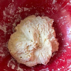 Should the dough be sticky because mine is very or should I put in more flour until it stops being sticky