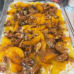 Cook time says 30 to 40 minutes . If you want the crust to rise try cooking 1 1/2 hours . If it looks like it could burn then just cover till it rises . Other than that , I really enjoyed this dish. I served w/ vanilla ice cream. I also added pecans do not add pecans till the last 10 minutes or they will burn. I used a lot of peaches lol no brainer .. I also added cinnamon, nutmeg and brown sugar to the peaches