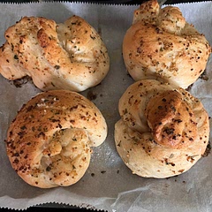Made the dough per instructions, once out of the bread machine, I turned them into garlic knots!

Section into 8 pieces, turn each piece into a log, then tie into a ‘knot’
Let rest per original recipe instructions. 
Brush with 4TBSP butter mixed with minced garlic, salt, pepper, & parsley (measure with your heart) made 8 good sized knots. 
Baked for aprox 18 minutes.