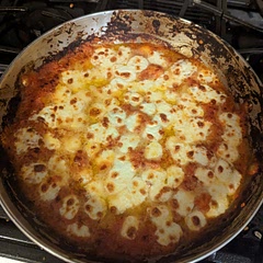 This meal was brought to you by my finally realizing we have a broiler, because somehow I've overlooked that thing for years.

This was my first time eating gnocchi and I was not disappointed! I was very happy with the result and I will definitely make this again. 😋 It reheated in the microwave just fine without becoming "rubbery," but I didn't have them in there longer than a minute and a half. Remember to chop the onions real small. 

~
¼ c. 🫒 oil, medium heat. Add 4 Italian parsley stems, 4 oregano stems, 2 rosemary, and 2 basil. Cook ~5 mins or until crisp. 

Remove and discard the herbs, then add a diced half yellow 🧅 and 3 minced/pressed 🧄 cloves. Lower the heat if necessary to gently cook the onions (don't brown) for 5-7 mins or until transparent. Then crush the 🍅 with your hand and add to the pan with their juice. 

Season with kosher 🧂, pepper, and red 🌶️ flakes and simmer 30-40 mins [20 minutes is better for me], or until the sauce reduces and thickens, stirring occasionally. [Remember to heat water in a pot to cook the gnocchi.] Stir in ¼ c. heavy cream if you'd like and remove from heat. 

Once pot of water is boiling, add gnocchi and season generously with kosher 🧂. Once gnocchi floats to the top, drain and add to the pomodoro sauce. 

Top with halved mozzarella balls and sprinkle ½ c. grated parmesan 🧀, and drizzle tops of gnocchi with a tbsp more 🫒 oil. 

Broil 5-8 mins, until cheese melts and the tops are crispy. Garnish with additional basil leaves.