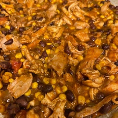 I used chicken thighs, shredded the thighs when it was done and served over mexican rice. 
Cooked for about 1.25 hours 
Very tasty dish