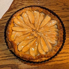 Holy moly this was delicious. 

Changes: first off, instead of using phylo dough, I used two sheets of puff pastry from the grocery store. Store. I rolled them out together and thinner. I used regular Bosc pears, the same amount of sugar and the same amount of butter. Instead of making my own caramel sauce (because I'm terrified of doing so honestly), I bought the Smuckers store bought kind in a jar. I grated some sea salt into it, and put it in the microwave for about 20 seconds. Then I brushed it over the top after the tart was cooked as directed. Cook times were the same.

It came out PERFECTLY!!!!! My entire family devoured it. My husband's favorite flavor is pear and so I was really hoping this would be a hit. I served it with vanilla ice cream drizzled with a little bit of the caramel sauce. 100% will make again.