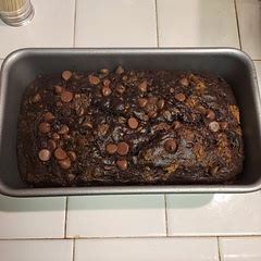 I added a scoop each of pureed roasted sweet potatoes and butternut squash. Needs a tad more oil or something, but this bread is delicious, definitely very similar to chocolate cake. 