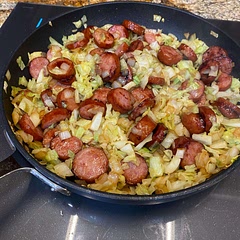 Quick and simple - cooked the keilbasa off first so I skipped the oil and browned the onion/cabbage directly in the keilbasa fat.