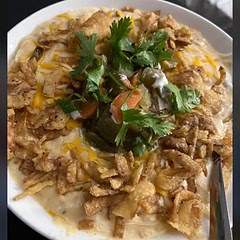I add extra cream cheese and some slap your mama for a little more spice. Then top with sour cream, fried onions jalapeño and cilantro. 🤤
