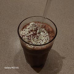 Made it with soy milk and date syrup, topped with whipped cream and grated chocolate. It was really good 