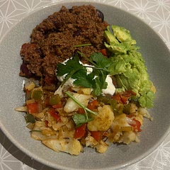 I added a tin of tomatoes and kidney beans to the minced beef and served onions peppers and cauliflower as a rice substitute. Finished with a dollop of Greek yogurt. Really delicious! Enjoyed by the whole family.