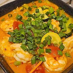 I doubled the recipe and added more veggies (zucchini, yellow squash, carrots, tomatoes, and used bok choy). Instead of red chilies, I used red chili flakes, cayenne, and added some coriander, white pepper, and chicken bullion. I also topped with lime and green onions. I skipped on the coconut rice. It's definitely something we'll make again!