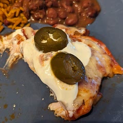 Forgot to take a picture before it was half-eaten.
Not the most flavorful meal, but it was very easy to make. I added some Cajun seasoning and put some jalapenos on top after cooking (I like spicy food).
Served with beans and rice