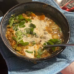 I whipped up some feta with tzatziki and garlic powder as a topping and added extra cilantro. I used a bag of frozen veggies instead of fresh and substituted red and regular lentils for green since that’s what I had.