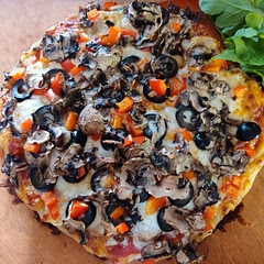 Great technique even when loaded up with toppings. Used mozzarella, Italian sausage, olives, red bell pepper, and mushrooms sliced thin on mandolin (3-4 per pizza). Under the broiler for 6 minutes. Out of the oven topped with roasted garlic, Mama Lil's peppers, and arugula. May try dividing the dough into fifths for a thinner crust. Overall very pleased with the results!