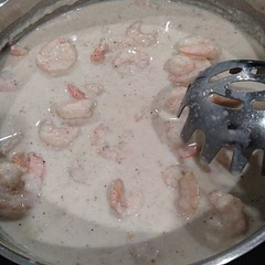 I used a container of Romano & Parmesan cheese from TJ's. 4/5 garlic cloves well minced, cooked in butter until sauteed then added the flour to make a roux. Half and half instead of cream.