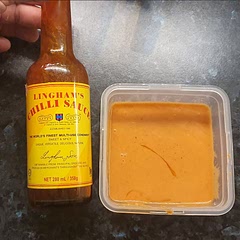 After making hot chicken tenders, I ran out of hot sauce so I substituted the hot sauce in this recipe for Lingham's Chilli Sauce and it tastes great!