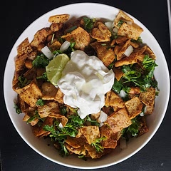 I made my own variation of Fattoush, and it turned out amazing! I cut the pita bread into pieces and baked them in the oven. I added roasted chickpeas. Greek yogurt was a great topping to the dish. I love this!