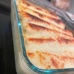 This is my husbands new favorite 

Personally I did shredded chicken with a can of Rotel and some shredded queso cheese 

Topped with white queso and shredded queso cheese 
Baked then let it broil until cheese was crusty