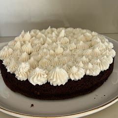 This is a rich and fudgey cake - you only need a small slice. It had a very slight coffee flavor so next time I will cut back a little on the espresso powder. I also used vanilla buttercream instead of mocha. Delish and delightful!  Wear your sweats!