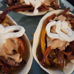 We made it into tacos by adding rice in the taco bowl. Then sausage and peppers are on top. Finally, top it off with sour cream and salsa mix. YUM!!!