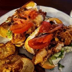 Delicious. I just melted the shredded cheese on top of the chicken. I didn't have regular hamburger buns, hence the potato rolls. I also only had cabbage so I chopped adding vinegar, lime juice, salt and pepper. 