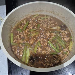 I added some veggies in the form of green beans and thickened the sauce with a corn starch slurry. Tastes delicious with a bowl of warm rice. 