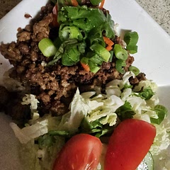 Served with wombok slaw, cucumber,  tomato, coriander and squeezed half lime over whole bowl.  Yummo