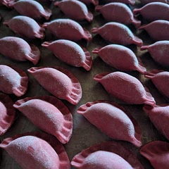 Used this recipe to make cheese and kolbasa stuffed mezzelune, used beet juice, gives the pasta a nice color and it's a lovely pink when cooked, nice consistency and tastes good