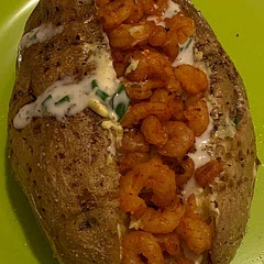 Slightly different version. I added shrimps and Greek sauce with peppers and green onion. I cooked the potato with butter instead of oil for at least 40 min. Meshed the potato with butter and mayonese. 