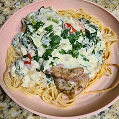 Grilled chicken thighs while adding kale and tomatoes to the sauce. Kids loved it!