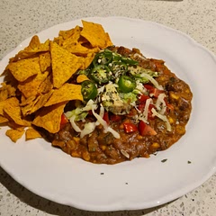 Served with green chilli instead of jalapeno. Served with Doritos (Chaos Cajun Chicken) tortilla chips. Delicious!