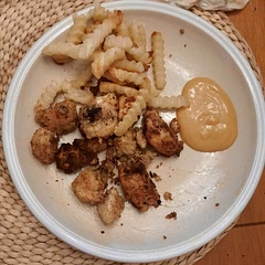 Made 16 servings for 6 ppl, 4 lbs of chicken, needed a lot more flour than prescribed, took a long time to make, made w frozen crinkly fries, bland without sauce