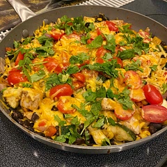 Added extra fresh garlic and granulated garlic to this dish. Also added extra cheese over the tomatoes and a generous topping of cilantro before serving. Before eating, we topped off with Cholula hot sauce. Yummy!