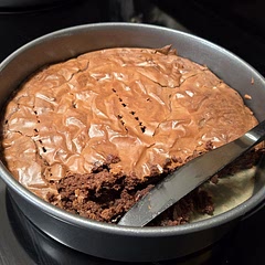 Crumbly but fudgy with very good chocolatey taste.