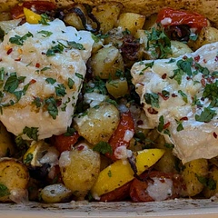 Browned the fish in a pan and added some sprinkles of chilli flakes and Parmigiano Reggiano on the fish. Plus added black olives with the tomatoes and lemon 