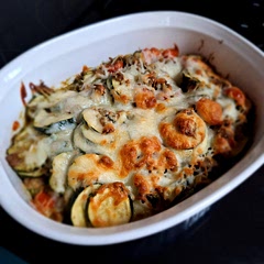 I decided to put it in a casserole dish after cooking as the recipe stated and baked it in the oven (350° for about 15 minutes.) I also added more shredded cheese in the last 5 mins and let that brown. I used a mixture of Parmesan, Mozzarella, and Provolone. We like the zucchini a little softer, so the extra baking turned out well! It is very tasty, and even though I only made 1/2 the recipe, I have PLENTY! If I make it again, I will still halve the recipe and possibly use fewer zucchini. There is a lot!