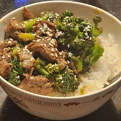 Maybe try splitting the sauce, broccoli and cooked beef to be cooked separately to prevent steaming and to prevent chewiness in the steak.