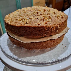 A fantastic cake! I always add more nuts than stated (100g) and toast them in the oven before baking (200°C for 4 mins.). They're more flavoursome done that way.  For the filling I used soft brown sugar instead of icing sugar and added some cooled, strong instant coffee to my personal taste. 