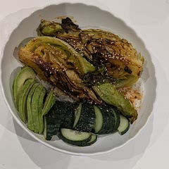 Cabbage elevated to star of the meal - spicy, buttery and sweet. I served mine over rice and added half an avocado and cucumber to refresh between spicy bites.

 I would add more gochujang paste next time for my taste. 